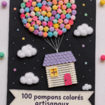 Un assortiment de 100 pompons colorés artisanaux sur une table