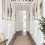 Cuisine moderne avec des murs blancs décorés d'art contemporain