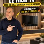 Salon avec un mur TV décoré de façon élégante et moderne.