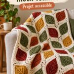 Plaid en crochet aux motifs de feuilles colorées sur un canapé accueillant